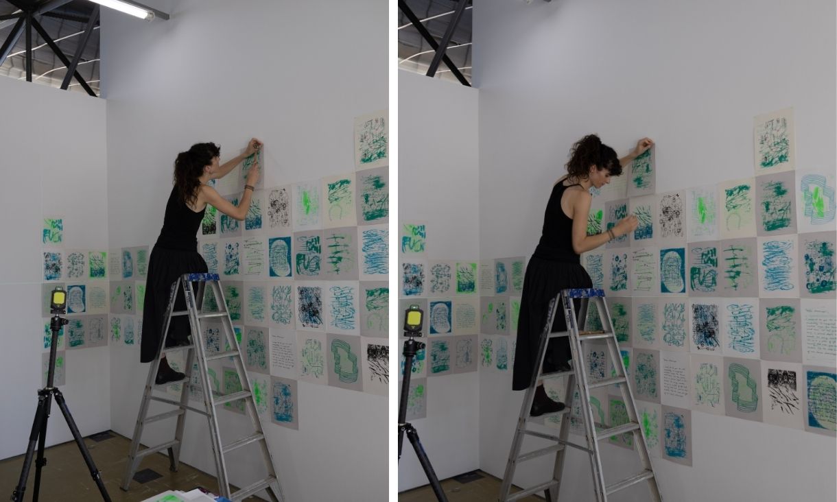 Elena installing artwork