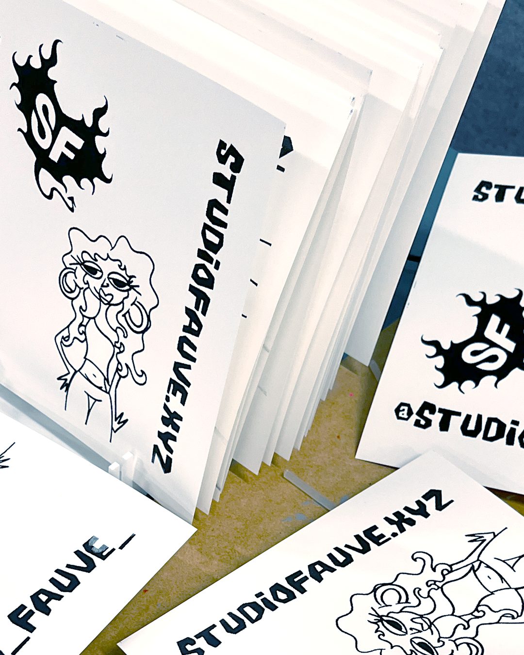 A stack of black and white Studio Fauve zines